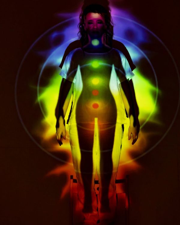 Woman performing a gentle stretching yoga pose, radiating positive energy.